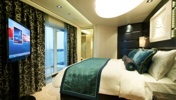1548636738.435_c357_Norwegian Cruise Line Norwegian Breakaway Accommodation The Haven Deluxe Owner Suite Bedroom.jpg